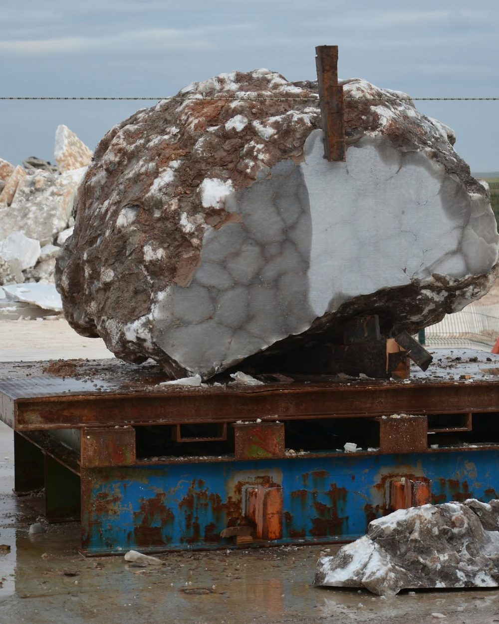 A block of alabaster opened on a pallet, white inside