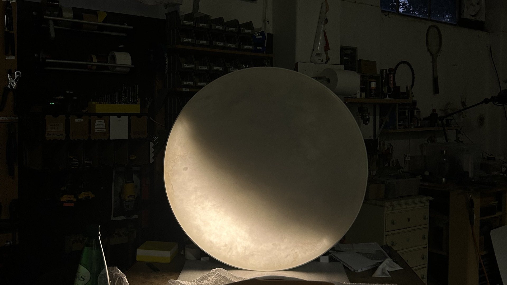 The first MOON Seventy, lit on the bench in the Lisbon atelier
