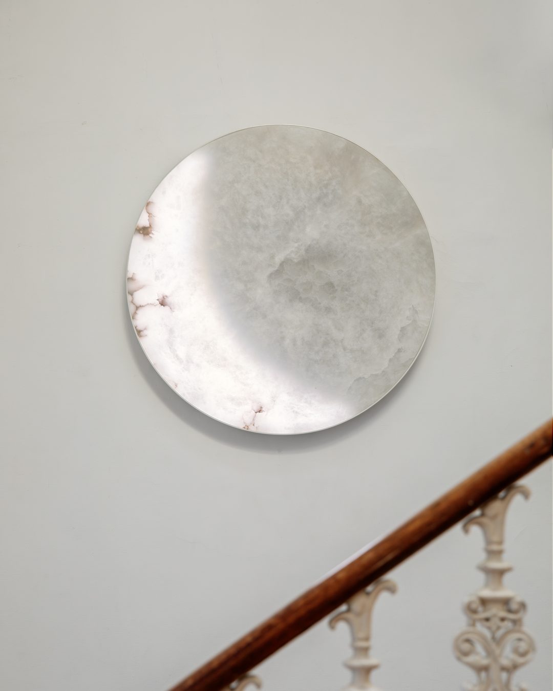 MOON Ninety above a carved staircase