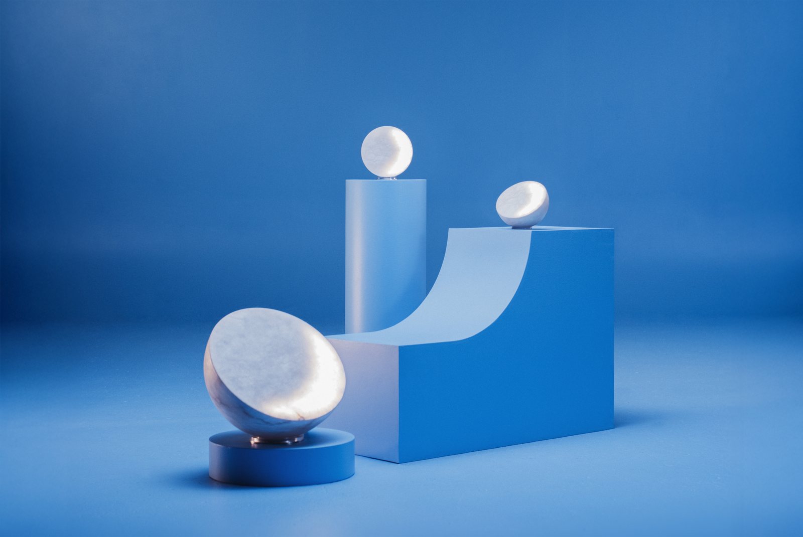 MOON Sixteen, Forty and Ninety Alabaster on blue plinths